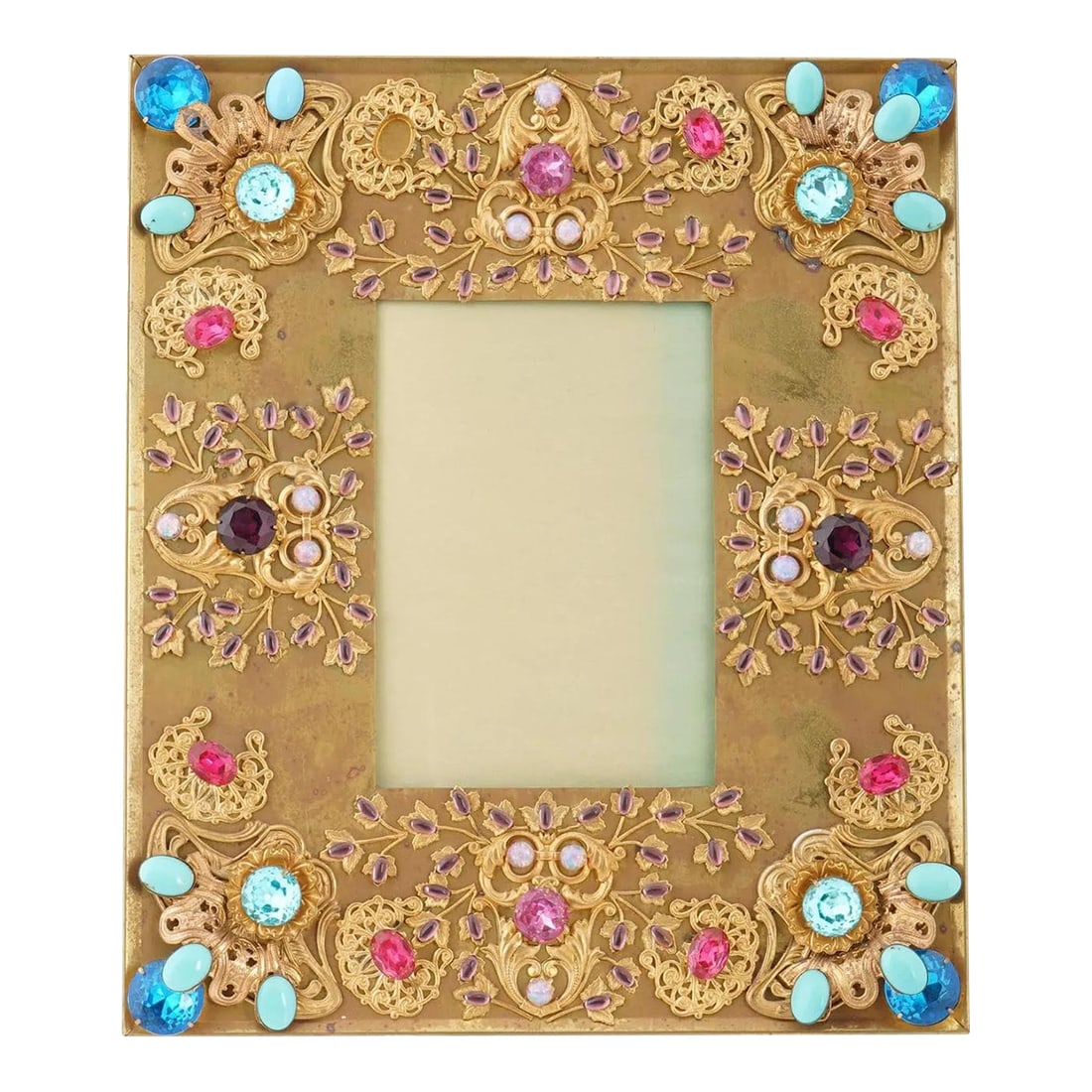 Early 20th Century Relief Design Gilded Brass Picture Frame, Marked: A vintage gilded brass picture frame. The frame features a relief design, adorned with decorative elements that include colorful stones and pearls, set against the gold tone background. The ware is