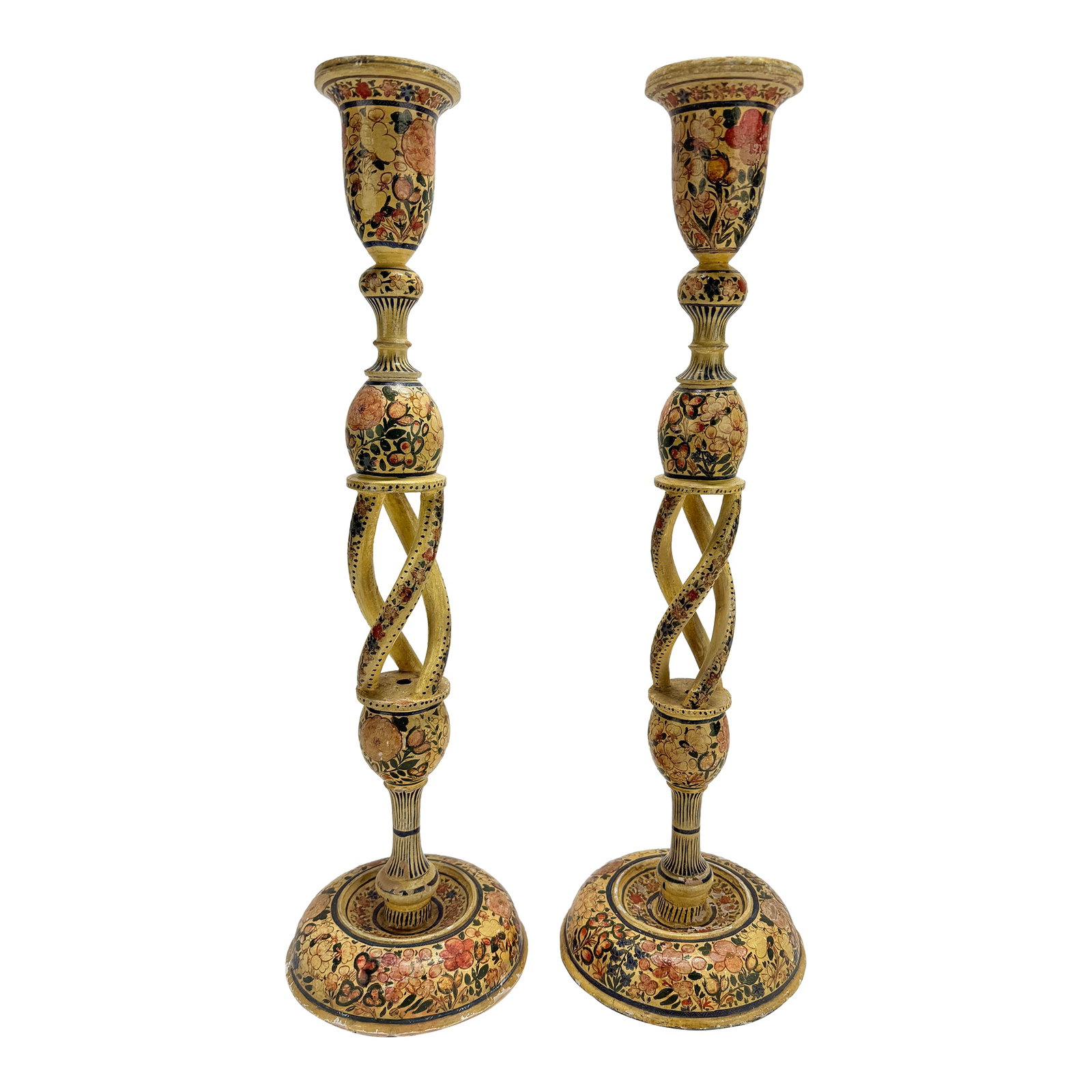 Pair of Antique Hand-Painted Kashmiri Spindle-Twist Candlesticks: A tall and elegant pair of Kashmiri wooden candlesticks, rising in attenuated columnar form to flared candle nozzles, each richly lacquered and hand-decorated throughout in polychrome floral reserves