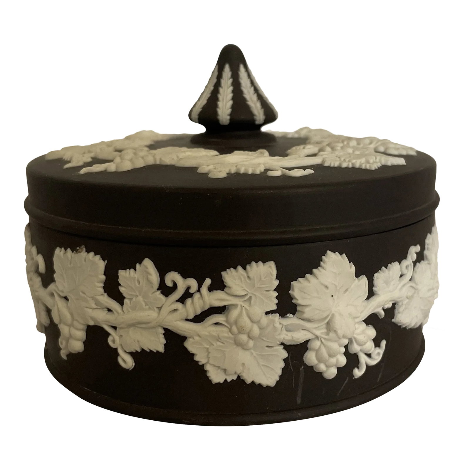 Antique Black Round Lidded Wedgwood Box: Beautiful black and white jasperware. The circular body is known as the "Large Carousel" shape as the knob on the lid resembles the shape of the fairground ride. It is profusely decorated with vine