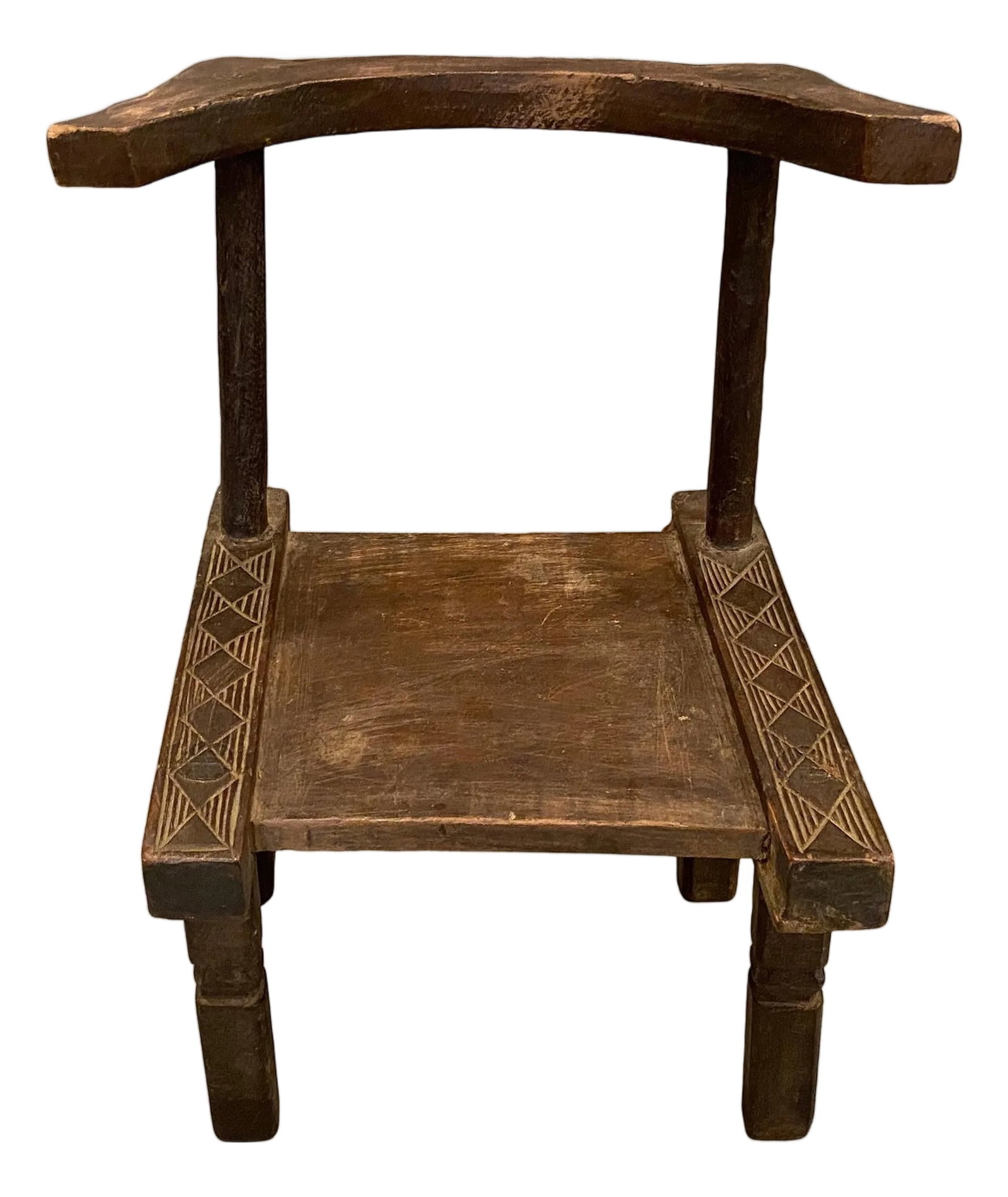 Antique African Wooden Chair or Side Table: Hand carved wooden chair from the Ivory Coast of Africa. This can also be used as a low side table. A piece of art. This chair was sourced in the spirit of wabi-sabi, a Japanese philosophy that beauty