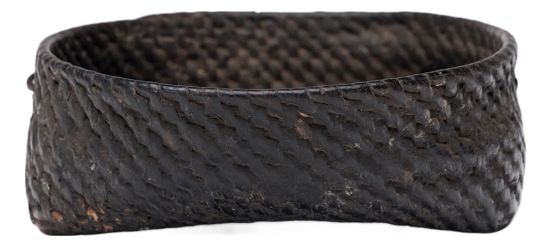 Chinese Black Lacquer Woven Tray, C. 1900: This small woven tray from the early 20th century celebrates the beautiful simplicity of a hand-woven object. The dish is tightly woven of bamboo to a square-to-round form and finished with a thick