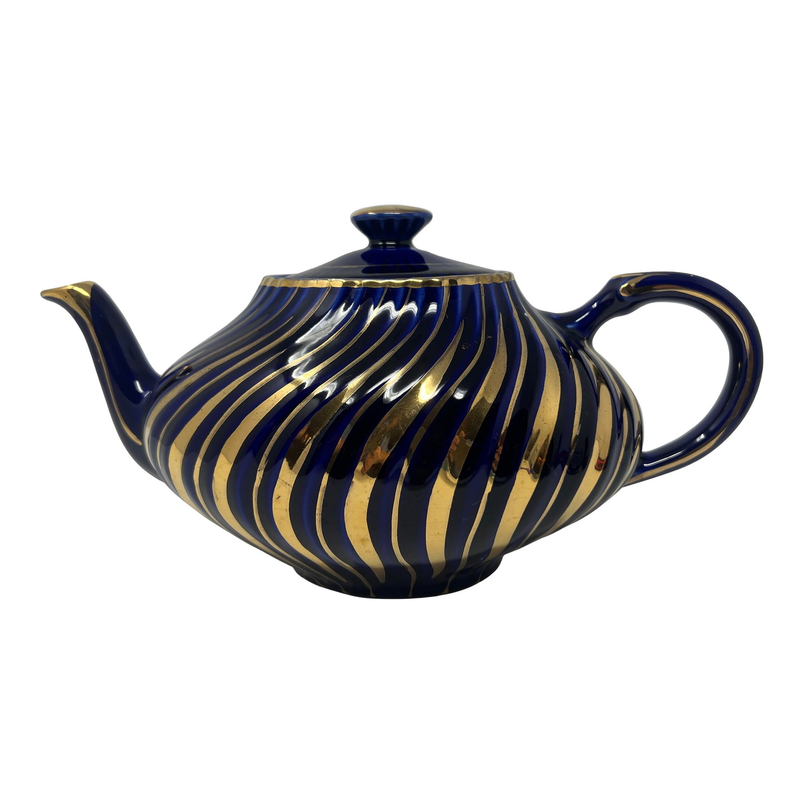 Arthur Wood Cobalt & Gilt Teapot | English Staffordshire, C. 1930s: Striking vintage teapot by Arthur Wood, produced in Staffordshire, England, circa 1930s-1940s. This sculptural form is finished in a rich cobalt blue glaze, enhanced with sweeping hand-applied gilt de