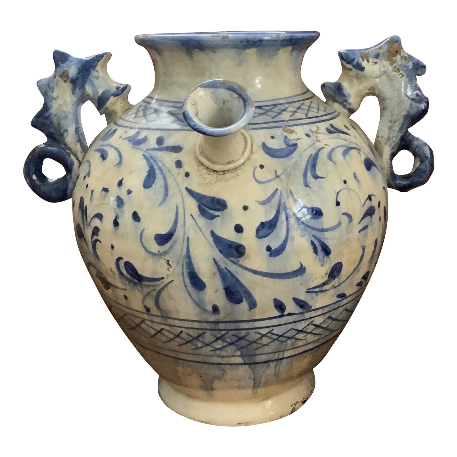 Mid 19th Century Large Italian Glazed Pottery Vase. With Seahorse Handles. Made in Tuscany for Fortu: Large Italian Pottery Urn Formed Vase With Seahorse Handles. Blue and White and Floral Painted Glaze. Signed Tuscany Italy For Fortunata. Probably the earliest known example. Condition: Alterations: O