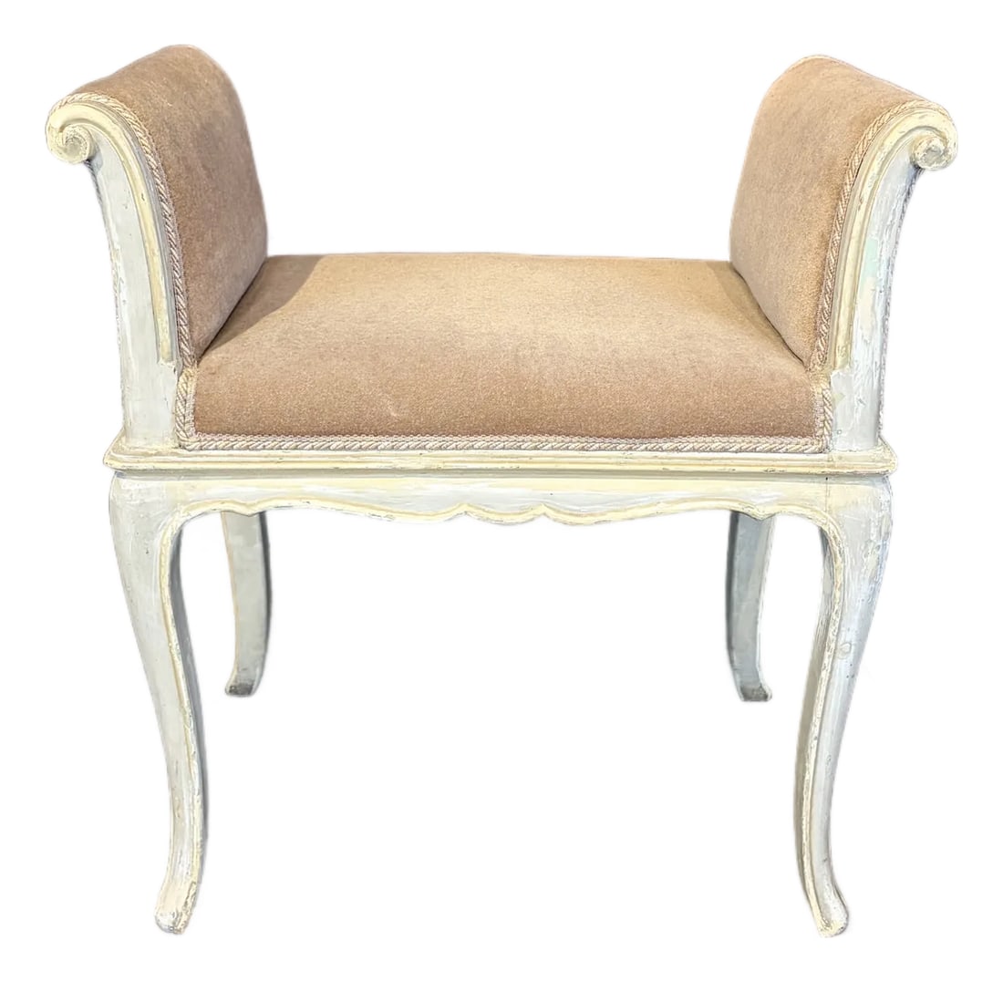 Antique French Painted Louis XV Banquette Bench: Elegant French banquette, bench or window seat in the Louis XV taste, featuring a softly painted frame with a carved apron, graceful scrolled ends, and cabriole legs. Upholstered in a warm neutral moh