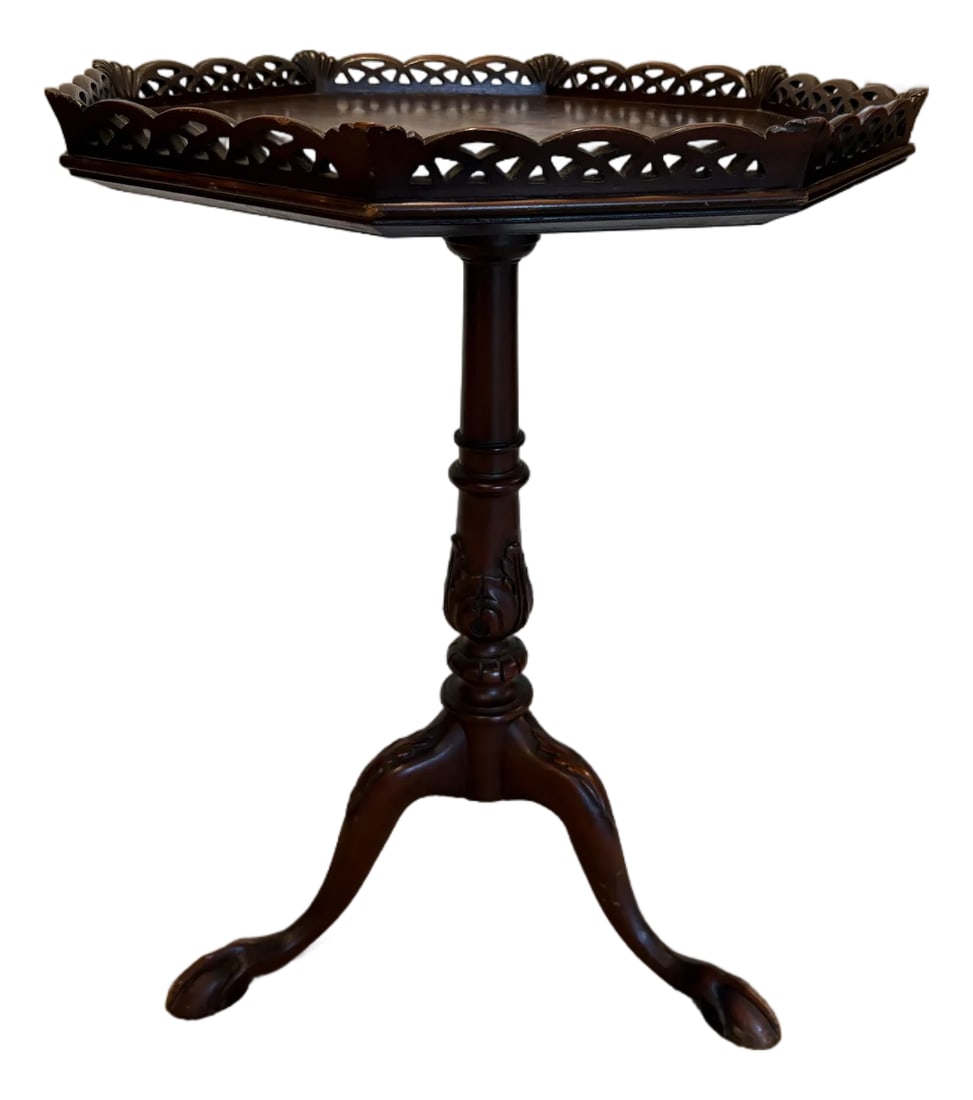 Vintage Chippendale Mahogany Octagonal Tea Table | Louis E. Rose Fine Furniture, Newark Nj: A superb example of Chippendale-inspired craftsmanship, this octagonal tea table commands attention with its exceptional hand-carved detailing throughout. The stunning figured crotch mahogany top is f
