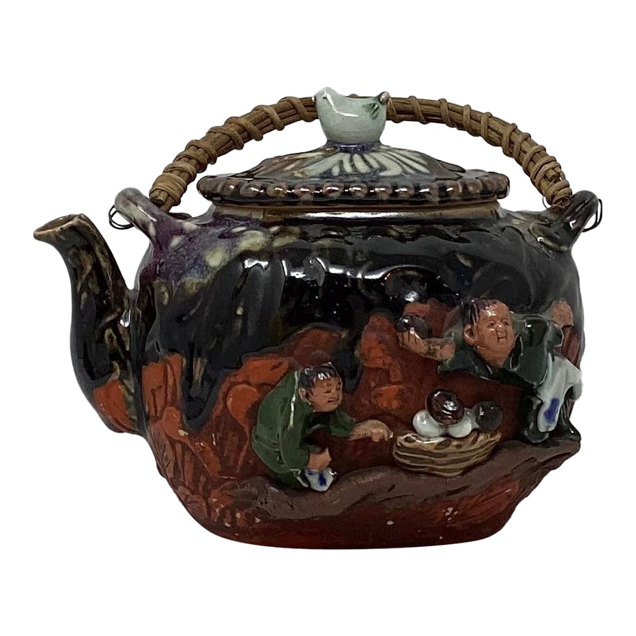 Antique Sumida Gawa Art Pottery Teapot: Sumida Gawa teapot. Vintage Japanese drip glaze over red ground. Figures on one side. Bird finial. Sumida Gawa art pottery teapot featuring figural "sages" on the side. The piece has a distinct
