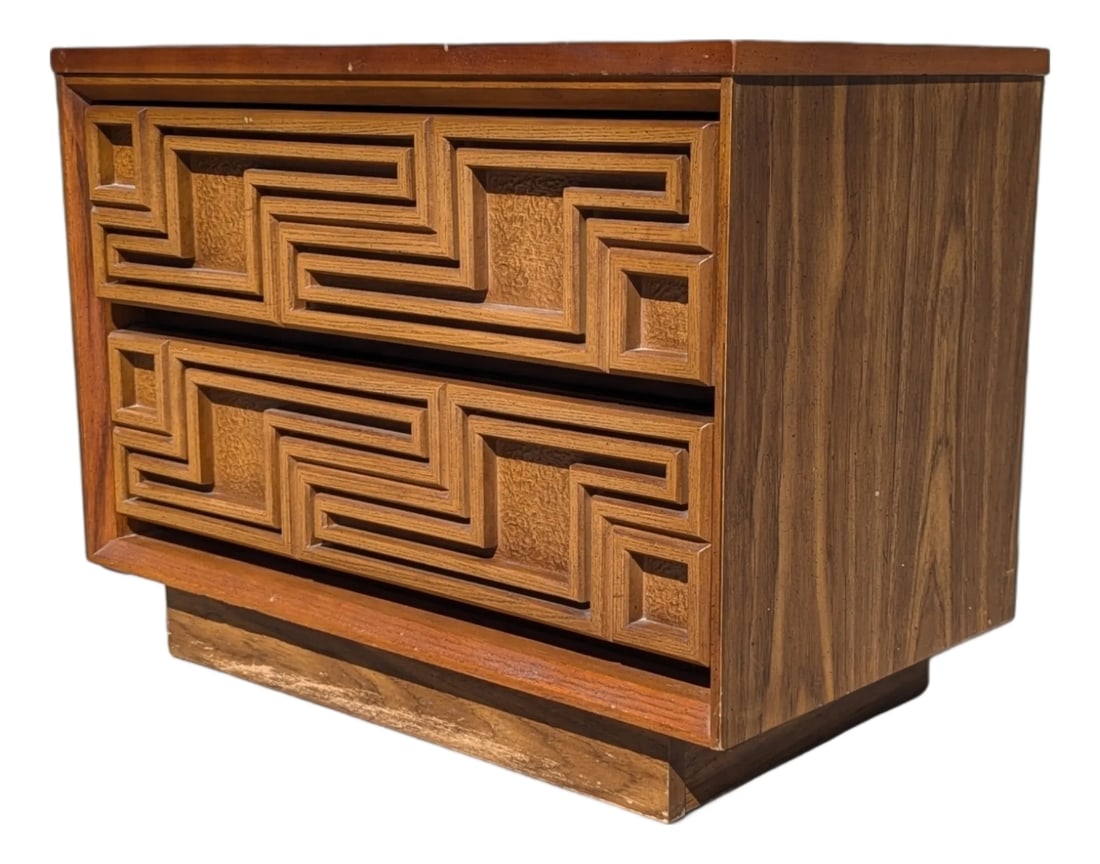 Bassett Mid-Century Carved Wood Two-Drawer Nightstand: A single vintage nightstand by Bassett Furniture Industries with a warm wood finish, two useful drawers, and a carved geometric front that gives the compact case strong visual texture. Its low proport