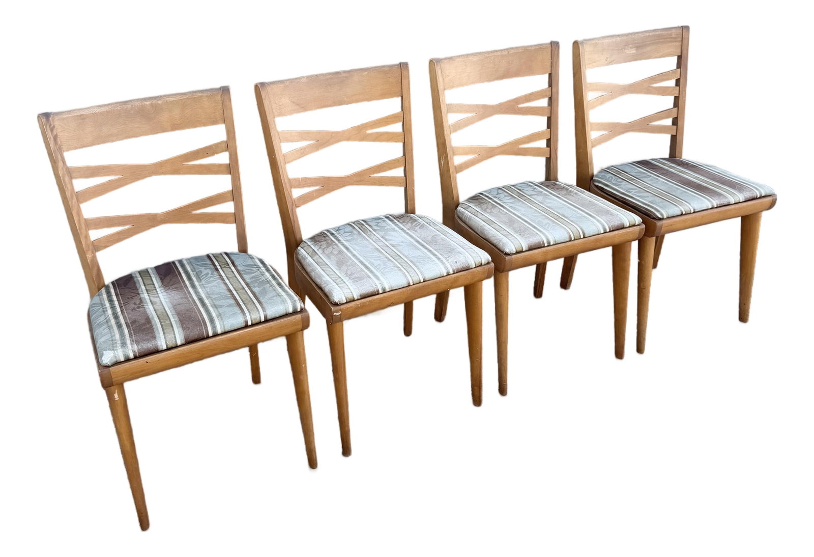 Mid Century Modern Double Cross Back Dining Chairs by Heywood Wakefield - Set of 4: A stylish set of four vintage mid-century modern dining chairs by Heywood-Wakefield, featuring warm-toned wood frames and distinctive double cross-back designs. Slender tapered legs and gently curved 