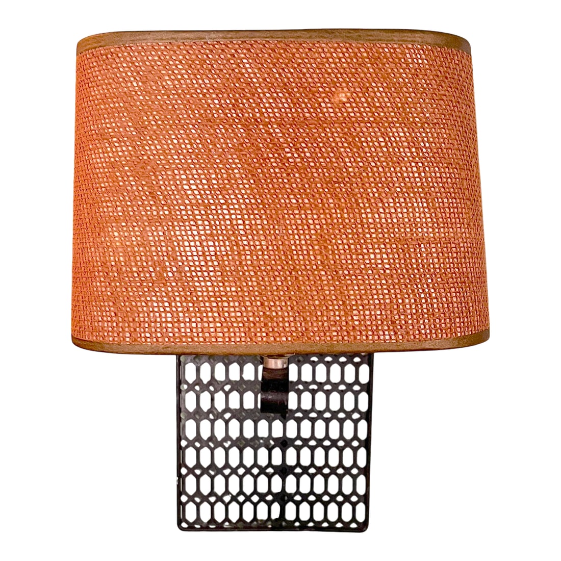 1970s Geometric Pierced Metal Wall Sconce With Original Woven Shade, Mid-Century Modern After Freder: Striking 1970s wall-mounted sconce featuring a pierced metal backplate with a repeating geometric lattice pattern. The dark patinated metal framework extends outward in a spare, sculptural arm