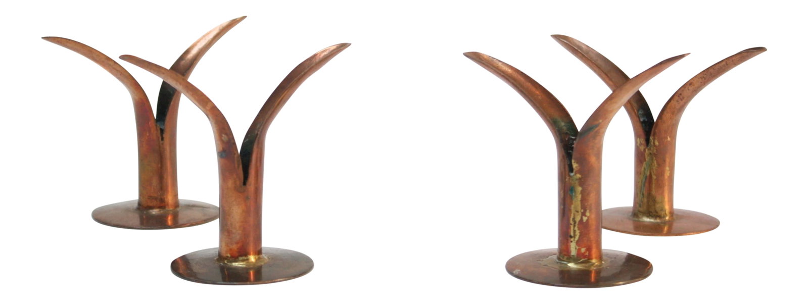 Set of Four Small Copper Ystad Candleholders: Set of four candleholders in copper attributed to Ystad Metall of Sweden. Unique, given their diminutive size (the photograph with the full size brass Ystad candleholder offers perspective of how