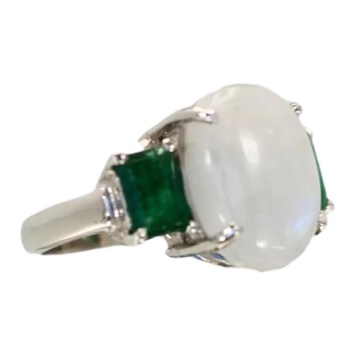 Moonstone 3 Stone Ring With Emeralds Size 6.5: This is part of Chairish's Fine Jewelry assortment. Moonstone 3 stone Ring with Emeralds This unusual Moonstone 3 stone Ring with Emeralds was made in my jewelers studio and it is gorgeous!