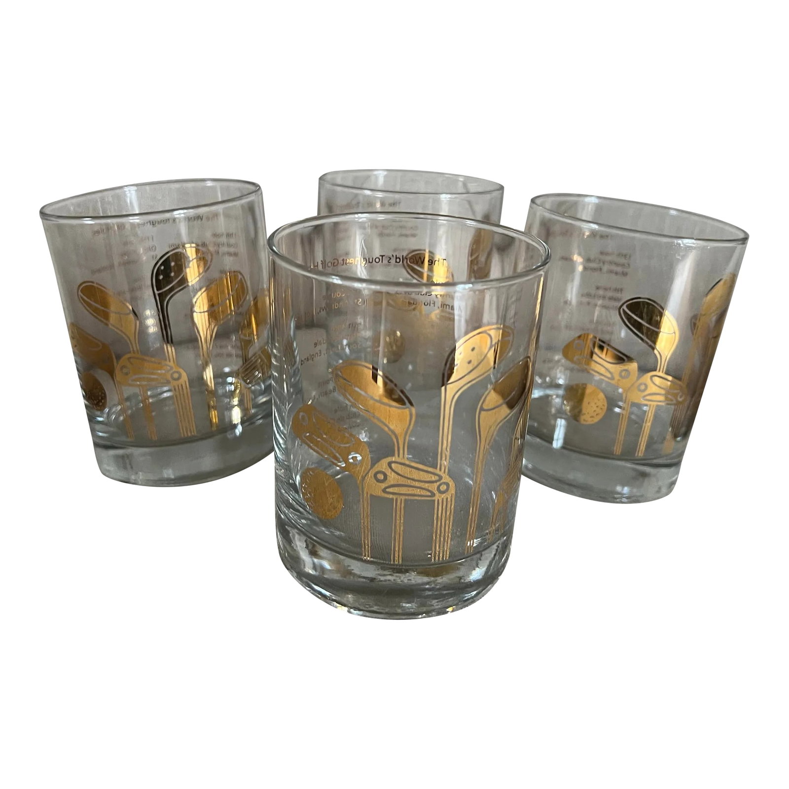 1970s Gold-Tone Golf Detailed Cups- Set of 4: Up for consideration is a beautiful set of glass cups with gold golf details. This would look lovely in your home or game room and is a great find for the interior design enthusiast. Please check out