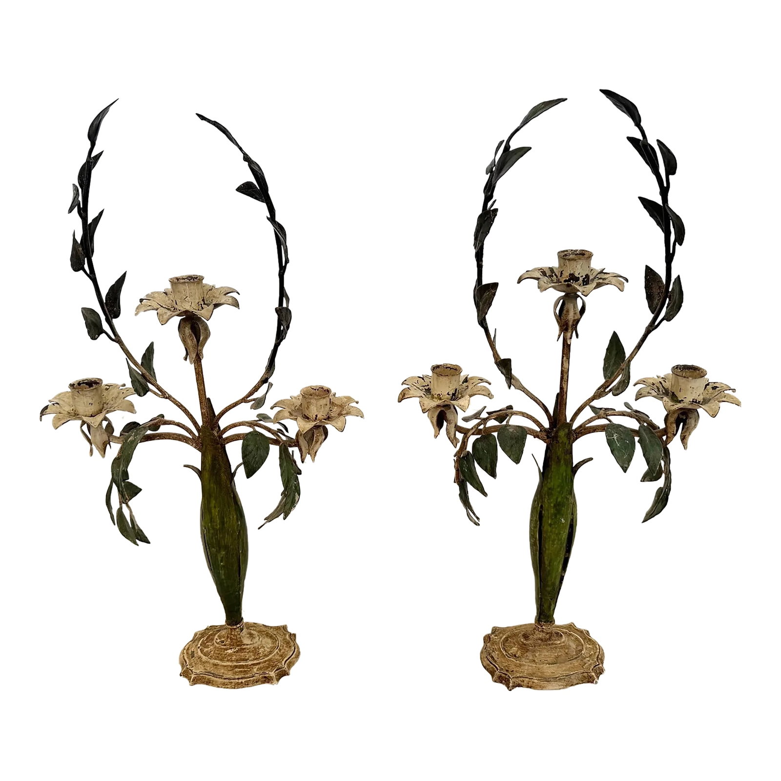 Vintage Painted Tole Candlesticks -A Pair: Lovely vintage pair of painted tole metal candlesticks having green leaves and creamy off white flower candle holders. Condition: Alterations: Original Condition Unaltered Imperfections: Some Imperfec