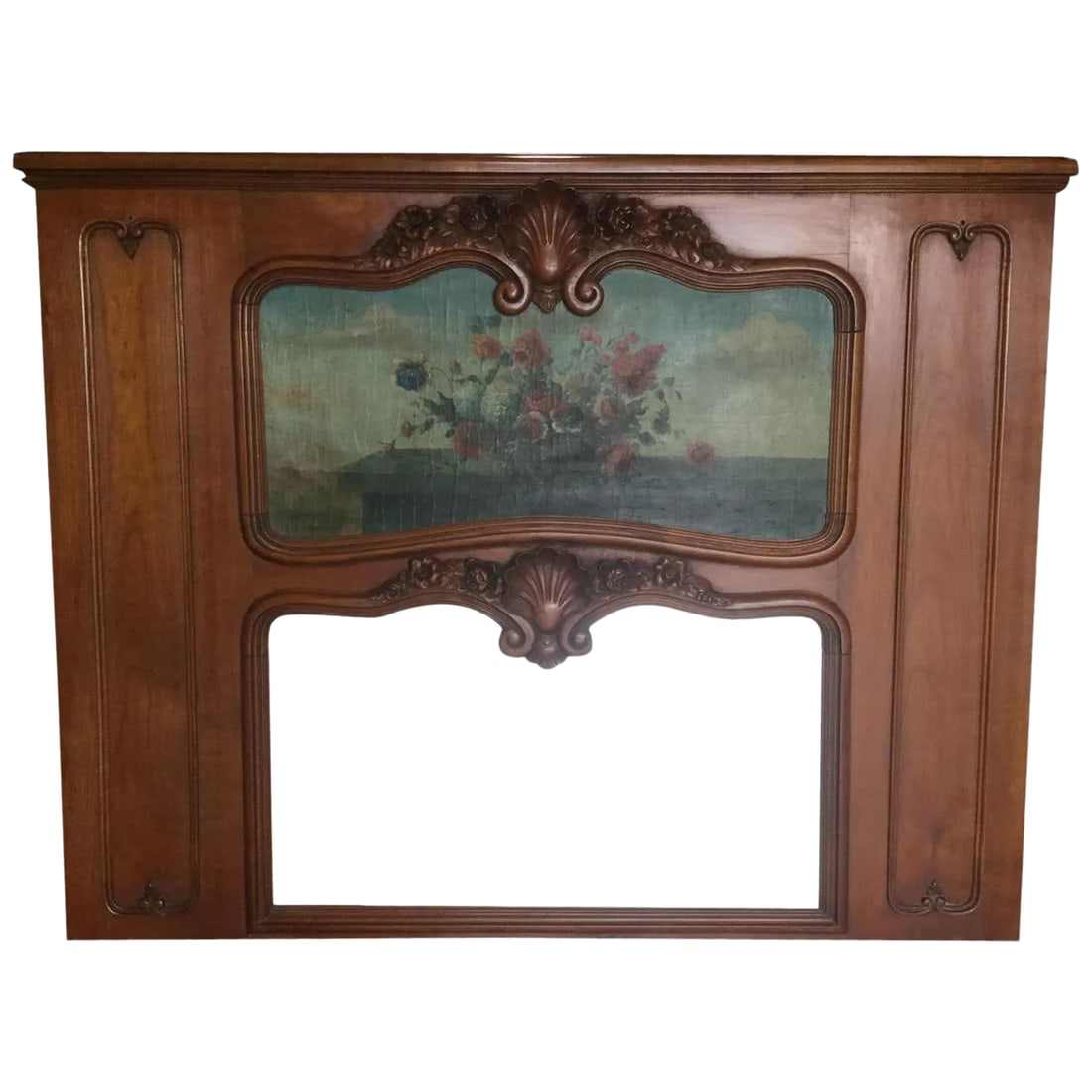 Antique French Trumeau Mirror: Stunning large French cherry trumeau mirror having a remarkably carved frame including roses, shell motifs and other floral designs. These carvings are 3 dimensional and very refined. The central