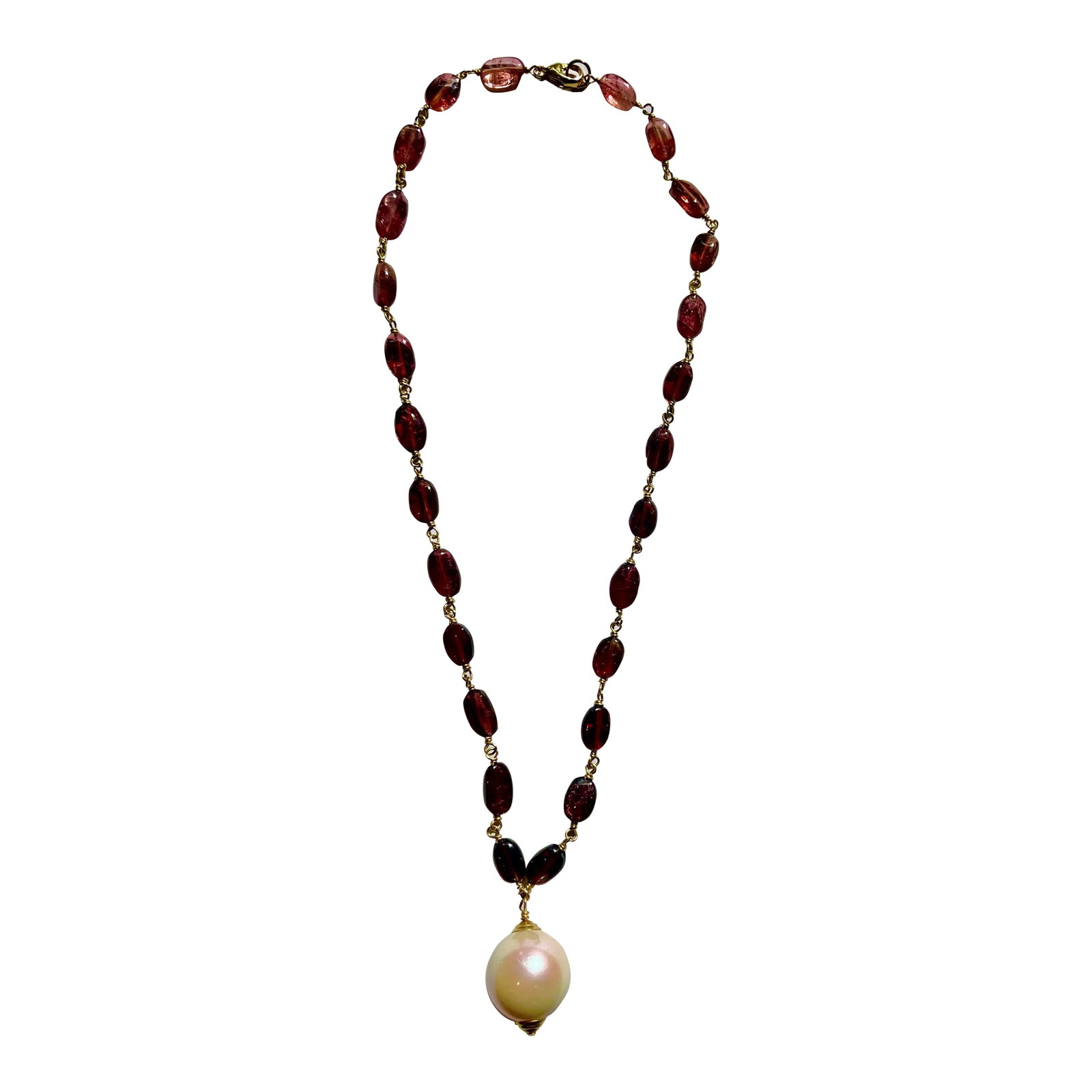 Pink Tourmalines With 18 MM South Sea Pearl Necklace: This is a gorgeous and festive necklace comprised of pink tourmalines with a dazzling 18 mm South Sea pearl. 16" long. 14k. Just in time for the holidays. Pair it with your favorite red velvet dress