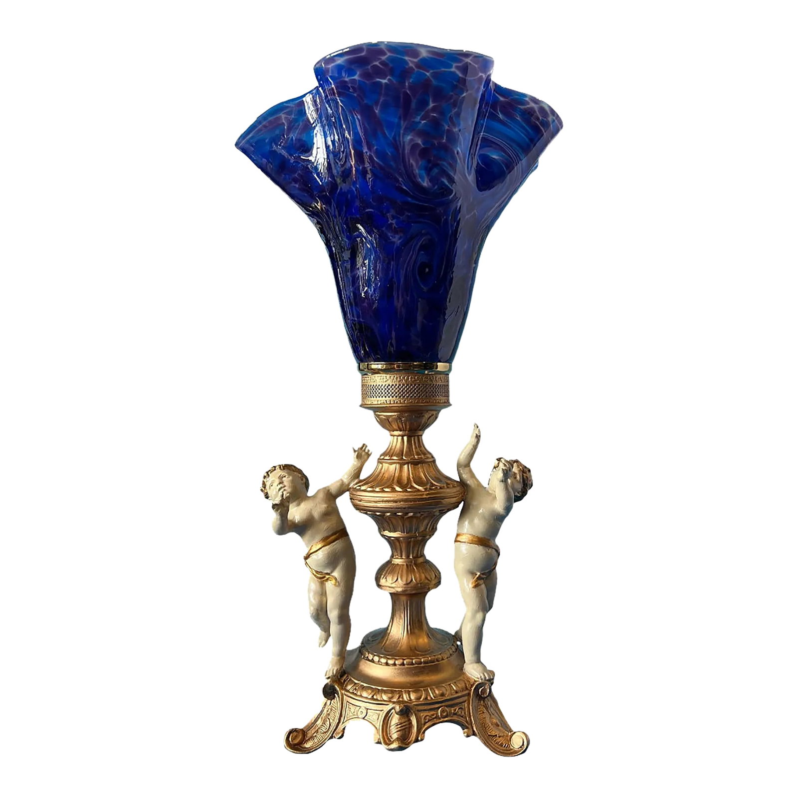 Vintage Cherub Blue Art Glass Torchiere Brass Table Lamp: This exquisite Mid-Century Spelter and brass lamp is a true masterpiece of elegance and artistry. At its heart, two enchanting cherubs with golden hair are frozen in a moment of joyous dance, their