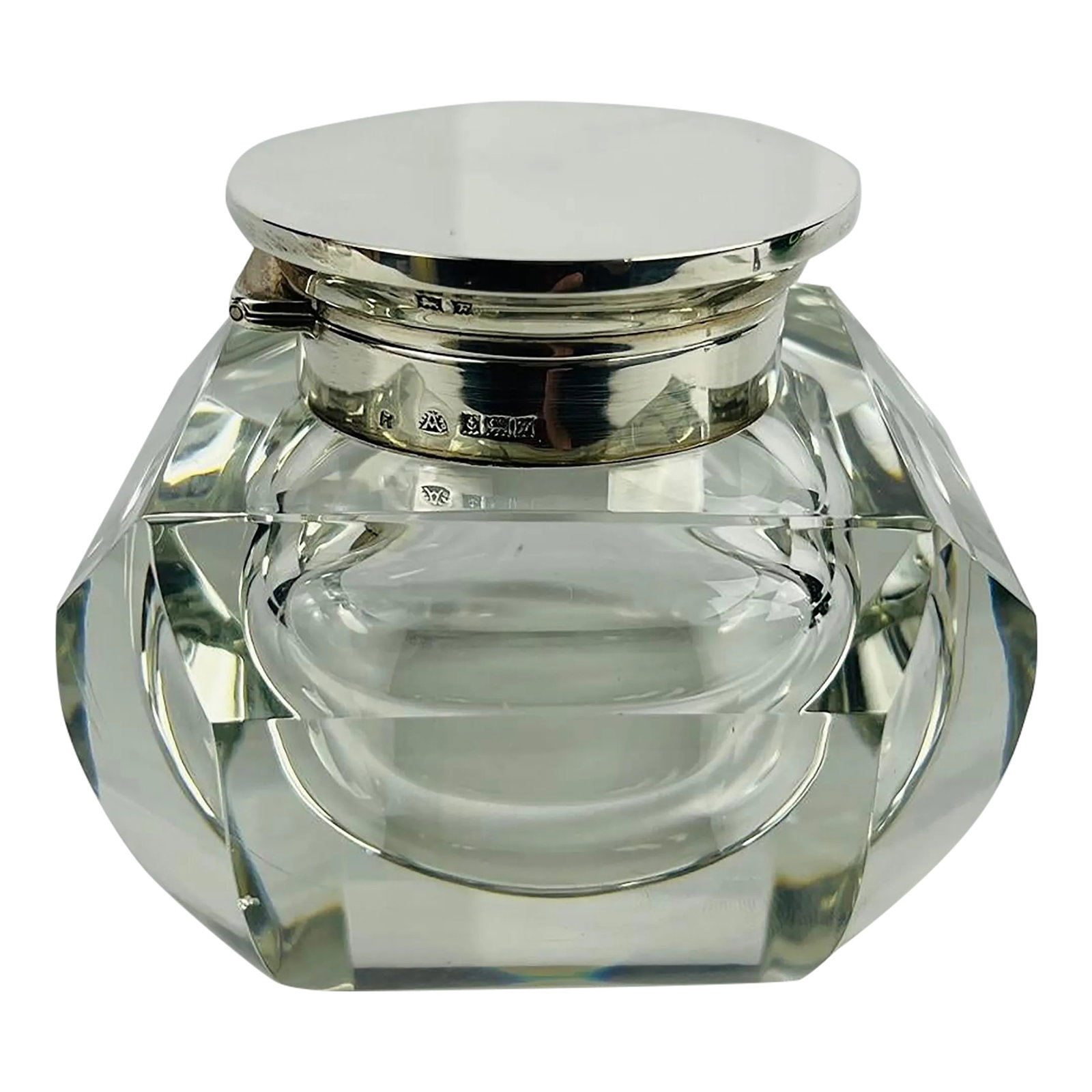 Adie Brothers Ltd, Sterling Silver & Crystal Vanity Jar or Inkwell C. 1955: This refined vanity jar or inkwell, crafted by the esteemed Adie Brothers Ltd, showcases the timeless elegance of mid-20th-century British design. The piece features a beautifully cut crystal body,
