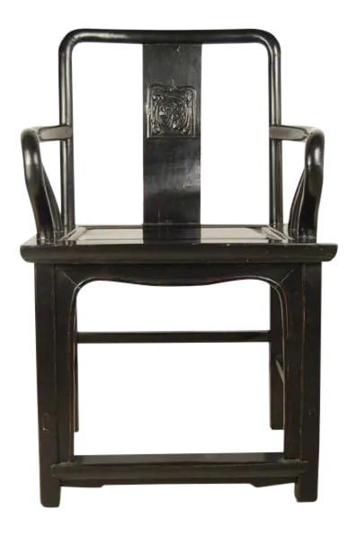 19th Century Chinese Black Guanmaoyi Chair: With its strong lines and upright stature, this imposing piece of furniture was the chair of choice for a 19th-century administrator in northern China. Made of northern elmwood, the chair has an