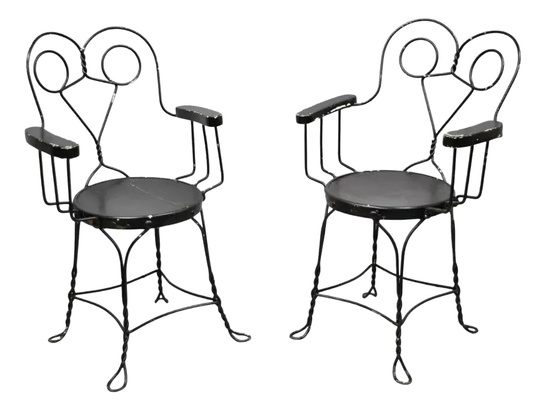 Late 19th Century Antique Wrought Iron Twisted Metal Ice Cream Parlor Arm Chairs Wood Arms - Pair: Antique Wrought Iron Twisted Metal Ice Cream Parlor Arm Chairs - a Pair. Item features wooden arm rests, wooden round seat, twisted metal frame, very nice antique pair. Circa Late 19th Century. Measur