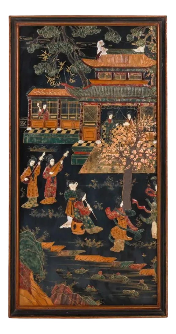 Framed Chinoiserie Panel With Stone Inlay: This captivating framed Asian panel showcases a masterful enamel and stone inlay on wood, depicting a serene outdoor scene of women playing musical instruments. The women are gracefully positioned in