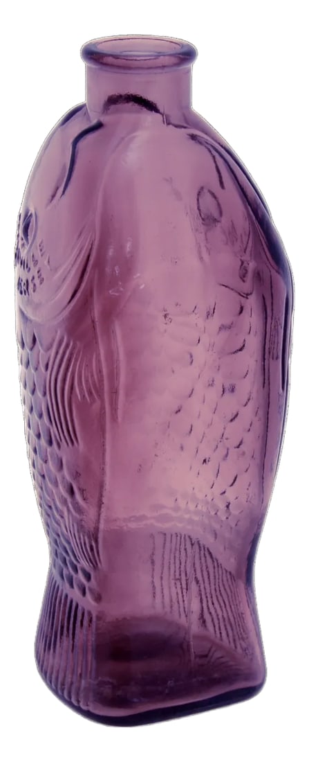 Amethyst Glass Fish Bottle Vase: Vintage glass bottle vase designed as a fish in purple amethyst. Flat bottom and flat one side for multiple display options. Marked "Wheaton, NJ; Millville, NJ; Doctor Fisch's Bitters." Condition: Alt