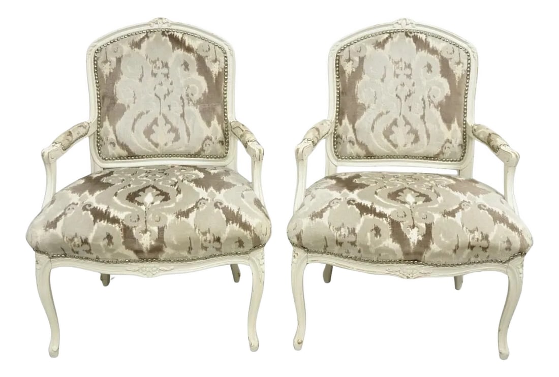 Vintage French Country Louis XV Style White Distress Painted Arm Chairs - A Pair: Vintage French Country Louis XV Style White Distress Painted Arm Chairs with Gray/Silver Printed Upholstery and Silver Nailhead Trim - a Pair. Circa Late 20th Century. Measurements: 37" H x 28" W x 26