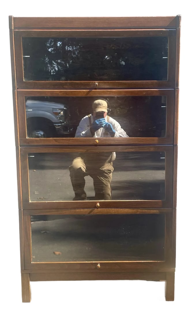 Lundstrom Sectional Barrister Bookcase Early 20th Century: Offered is a four stack bookcase in mission oak. It was manufactured by the C. J. Lundstrom Manufacturing Company. The patent number on the label indicates it was manufactured post 1914. The C.J.