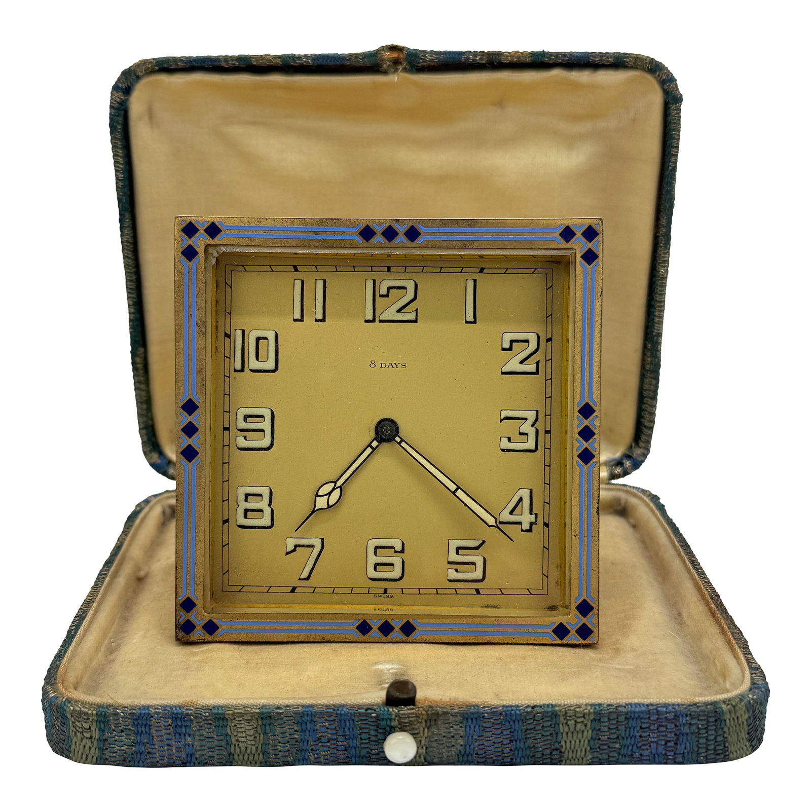 Swiss Art Deco Enamel-Border 8-Day Desk Clock, C. 1925-1935 *Luminescence*: A refined small-format Art Deco desk clock with an unmistakably Swiss 8-day movement, presented in a square gilt-bronze case with a fold-out strut back. The front is framed by a crisp geometric