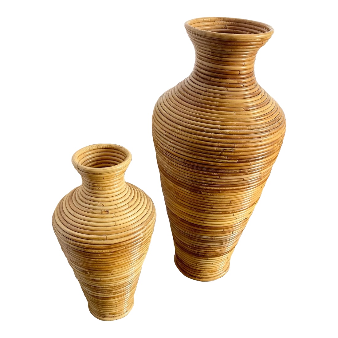 Boho Chic Pencil Reed Vases - Set of 2: Elevate your space with this set of two Boho Chic pencil reed vases. Handcrafted in a classic amphora silhouette, these sculptural vessels showcase tightly coiled rattan wrapped in a warm honey-toned 