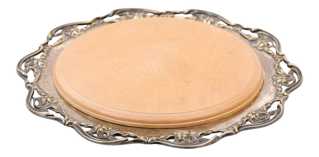R.F. Mosley & Co Enlgish Round Silverplate Tray with Pierced Scalloped Border: An English circular silver plated tray from the turn of the century signed R.F. Mosley & Co, with decorative pierced border. Created in England during the late 19th-early 20th century, this circular s