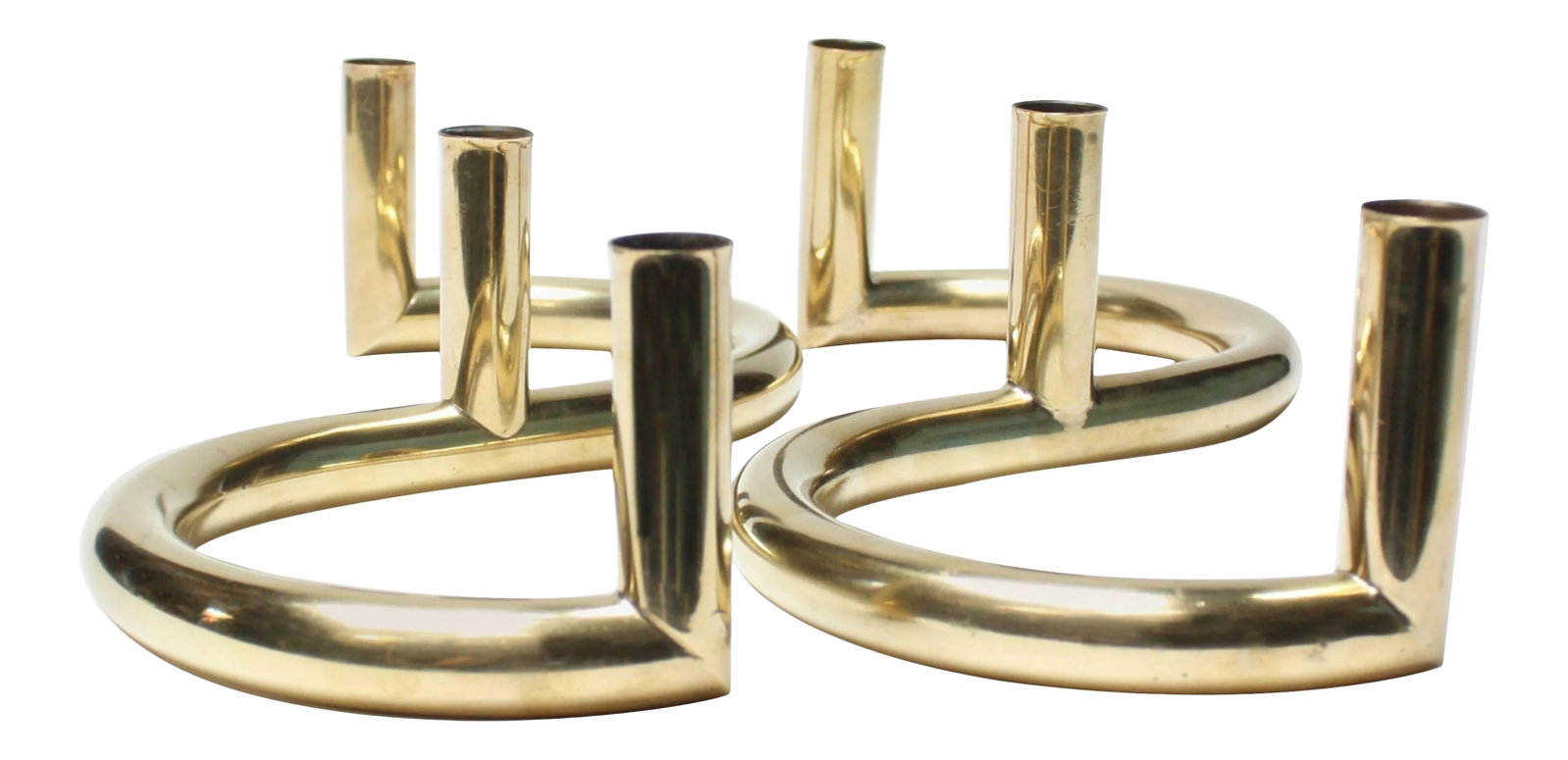 1970s Tubular Brass Candleholders - A Pair: Striking and large candleholders (three holders / set) in a reverse 's' shape boasting a curvaceous form and dramatic design. Polished condition with only minimal wear as pictured. Condition: