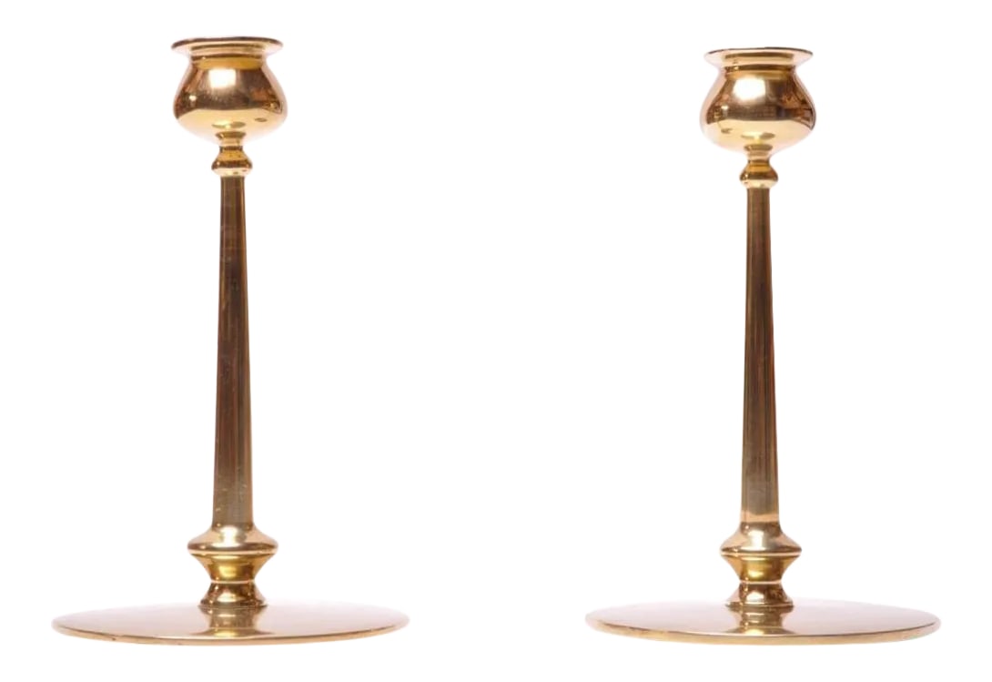 Mid-Century Modern Turned Brass Candlesticks after Jarvie - A Pair: Midcentury brass turned candlesticks, each with bulbous bobeche and cylindrical stem on circular base. Nice, polished condition with only minor wear consistent with age and history. Condition: