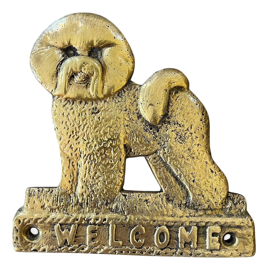 Vintage Solid Brass "Welcome" Dog Door Plaque - Shih Tzu / Bichon Frise Style Small White Dog: A charming vintage solid brass "Welcome" plaque featuring a sweet toy-breed dog in relief-reminiscent of a Shih Tzu or Bichon Frise-with a rounded face, softly textured coat, and curled tail. The