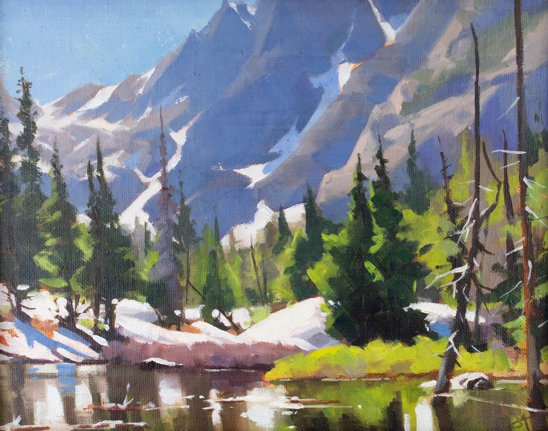Dream Lake by Judd Mercer | Oil Painting of a serene lake surrounded by mountains and trees: Dream Lake captures a serene alpine landscape, where towering mountains rise majestically in the background, their peaks dusted with snow. The tranquil water reflects the vibrant greens of coniferous