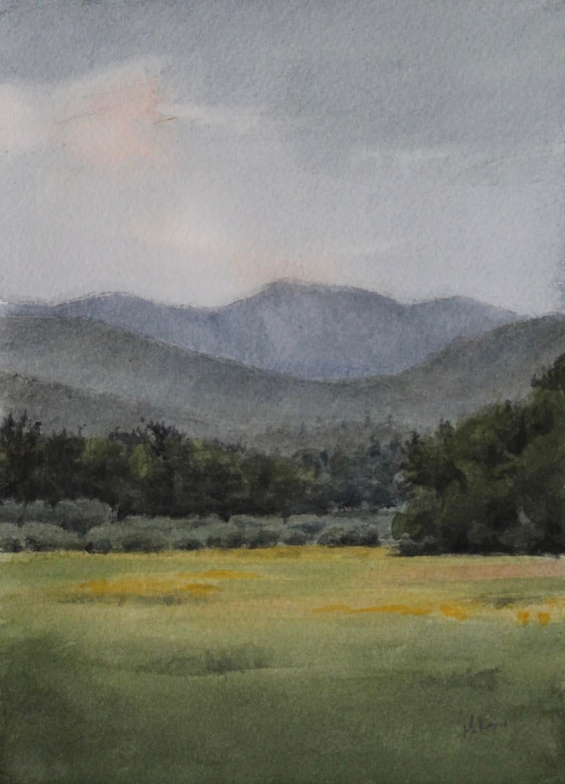 Possibilities of a New Day by Mo Myra | Watercolor on Paper Landscape with Mountains and Field: Possibilities of a New Day presents a serene landscape where gentle mountains rise against a soft, cloudy sky, hinting at the dawn of a new beginning. The delicate handling of watercolor captures the