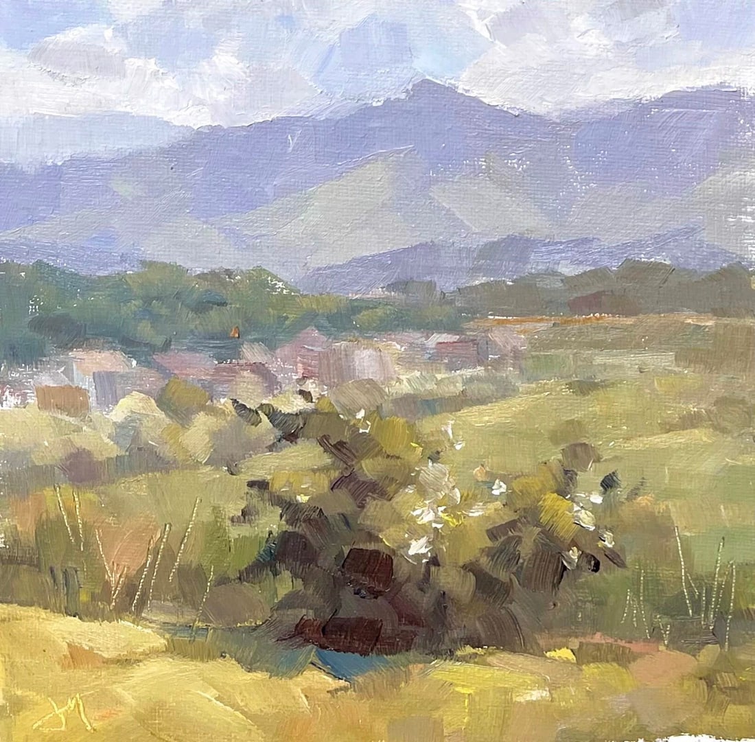 Last Mile by Judd Mercer | Oil on Panel Landscape with hills and distant buildings: This oil on panel artwork captures a serene landscape, featuring rolling hills and distant mountains under a softly clouded sky. The gentle brushwork conveys a sense of tranquility, with muted greens