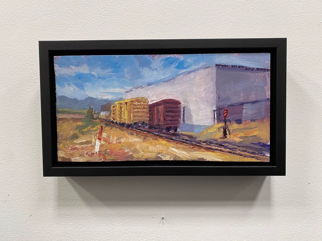 Trackside 2 by Delton Demarest | Oil on Board Painting of train cars near a building - 3