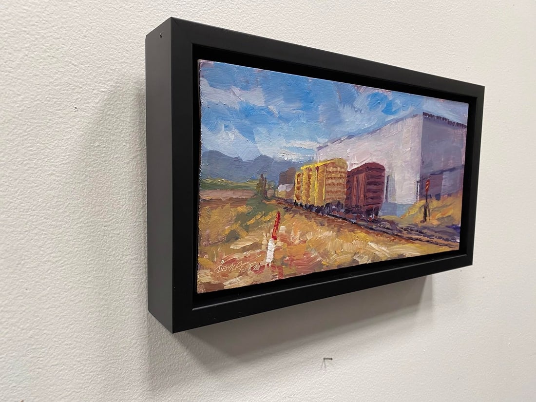 Trackside 2 by Delton Demarest | Oil on Board Painting of train cars near a building - 5