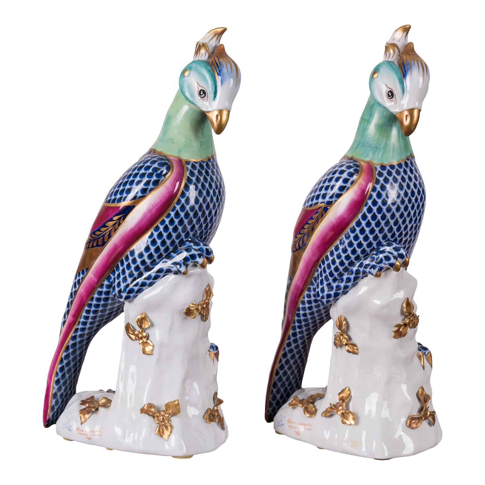 Sevres Style Porcelain Phoenix - a Pair: A pair of Sevres style porcelain figurines depicting a phoenix perched on a rock formation. 3 1/2 inches wide by 6 inches deep by 13 inches tall Condition: Alterations: Original Condition Unaltered