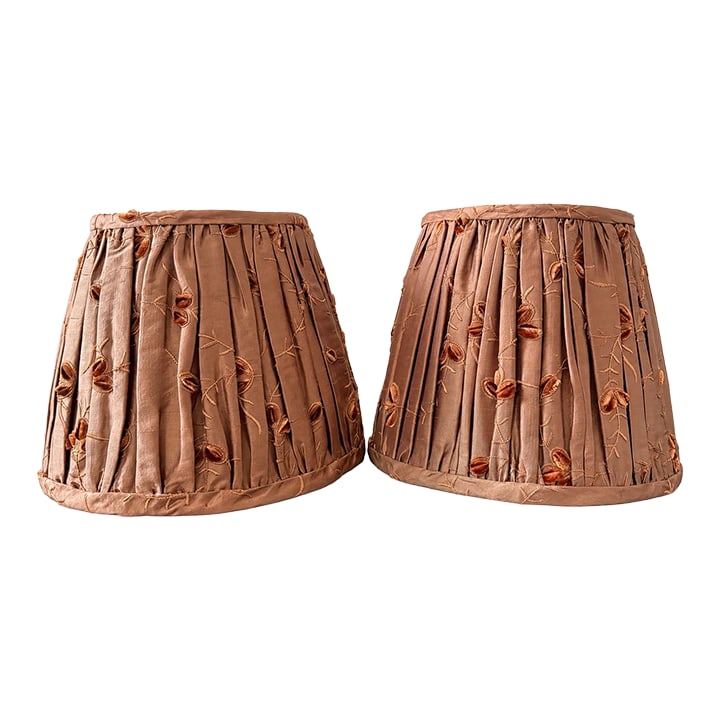 Pair of Vintage That Shady Lady Burnt Orange Pleated Silk Embroidered Lamp Shades: Elevate your lighting with this beautiful pair of vintage That Shady Lady pleated silk lamp shades. Expertly handcrafted in a rich burnt orange silk, each shade features elegant knife pleating