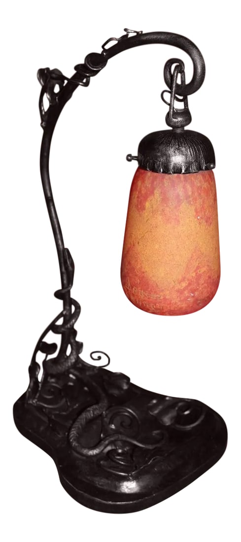 1920s French Art Deco Lamp With a Signed Daum Glass Shade: This is an authentic table lamp from the Art Deco period (1920's to 1930's). The base is wrought iron that features a snake that makes its way up the stem of the lamp along with some leaves also done
