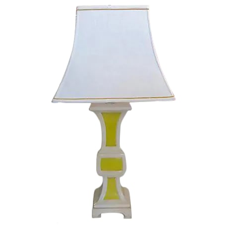 Hollywood Regency Yellow and White Ceramic Table Lamp: Tall yellow and white ceramic table or desk lamp with custom bordered linen shade. The lamp is mounted on a matching white painted wood base to protect the ceramic feet. Fully restored and rewired. Th