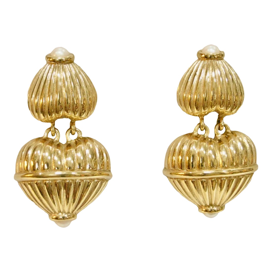 Givenchy Carved Gold Glass Pearl Dangle Earrings - 2 Pieces: This is part of Chairish's Costume Jewelry assortment. Givenchy oversized gold-plated carved dangle-movable, glass pearl top & bottom enhancer, comfort clip- back earrings. Signed, "Givenchy, Paris,