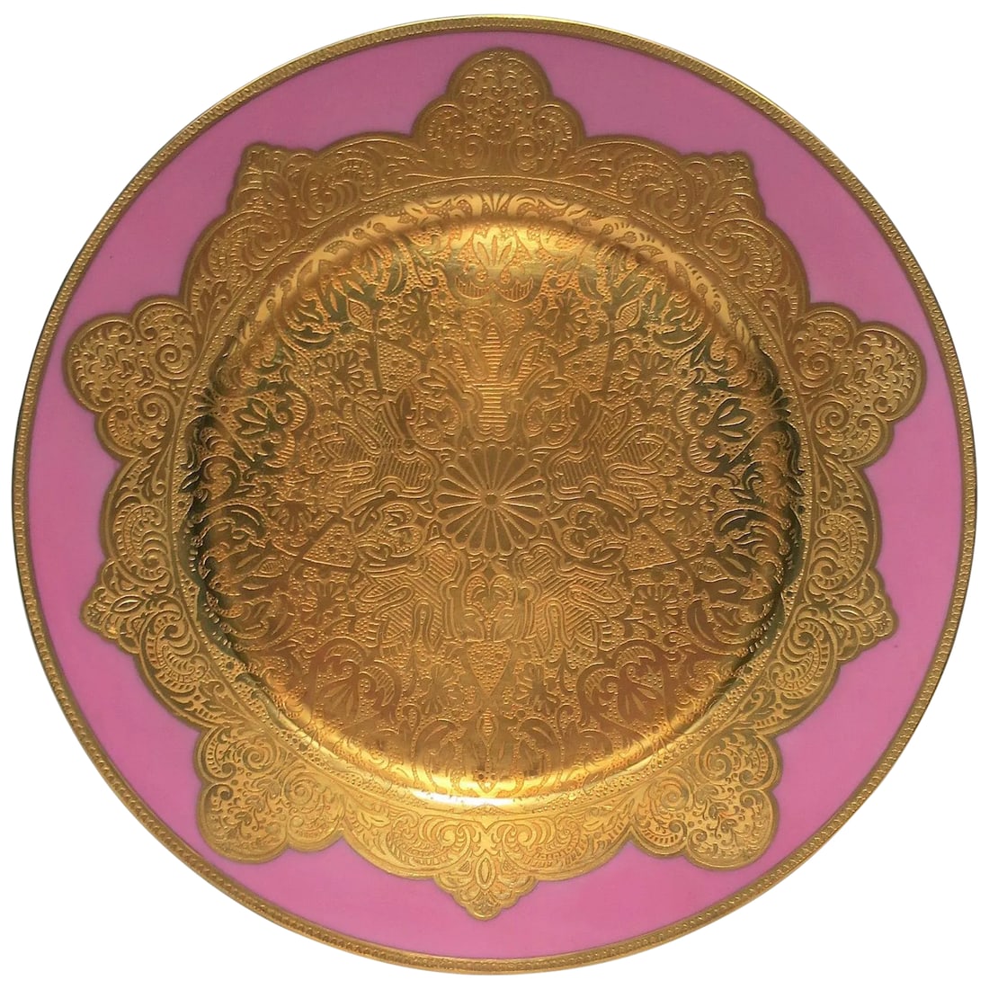 German Pink and Gold Plate or Wall Art: A gorgeous pink and gold gilt porcelain German charger or dinner plate, circa early 20th century, Germany. Plate has a heavy gold gilt edge and center, both are embossed with beautiful detail -
