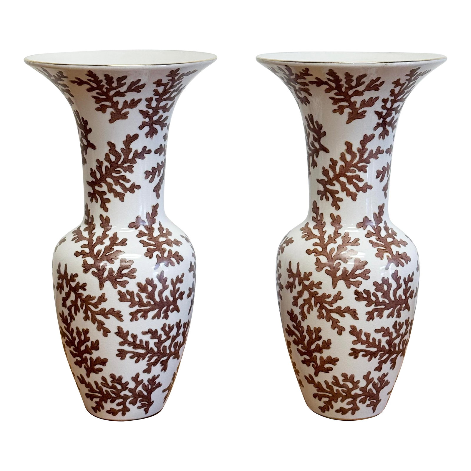 Vintage Coral Motif Porcelain Urn Pair: Vintage pair of porcelain vases or urns with coral motif. Rich ivory base with wide gilt gold tipped rims and brown coral design throughout. Crazing to finish throughout, appearing intentional. Each