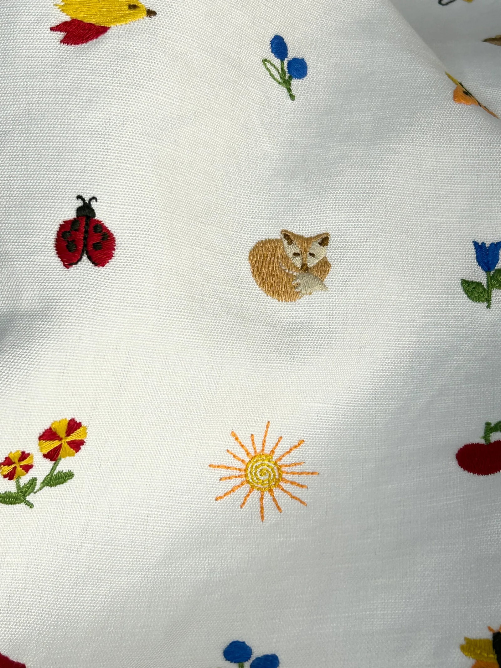 Schumacher "Tiny Things" Embroidery- 2.75 Yards: A very cute embroidery on a white cotton-linen ground of flora, fauna, woodland creatures in an endless group of colors. The 15 mini objects includes birds, animals, bugs, flowers, mushrooms and a