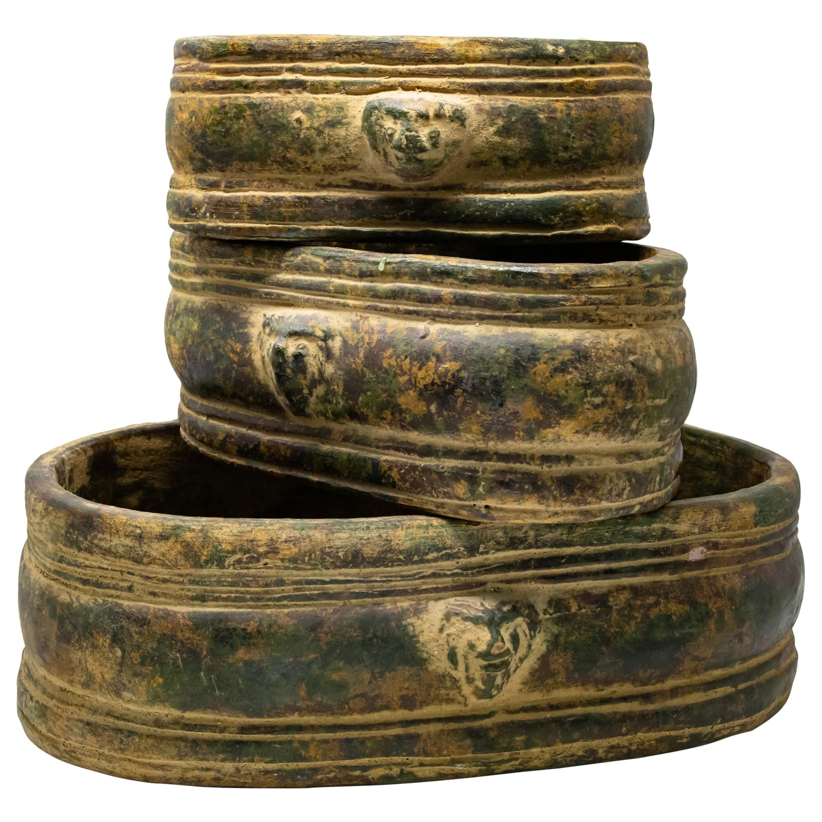 Terra Cotta Lion Head Gardenieres-Set of 3: Offering a set of three terracotta lion head planters. Elongated oval planters in graduated sizes from large too small. On either of the longs side to all three planters is Lions heads. Finished and