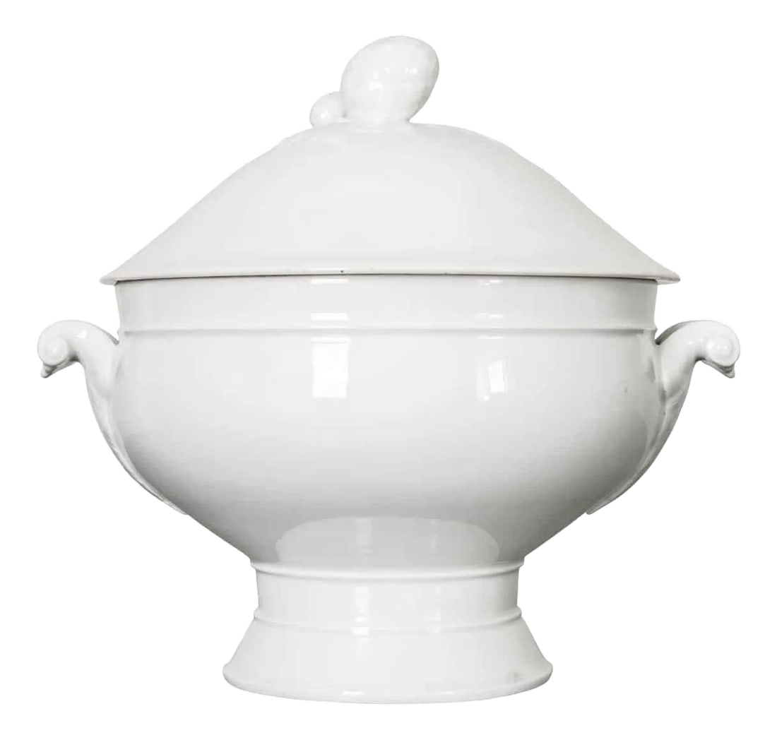 French Vintage Ironstone Lidded Tureen: A gorgeous early 20th century white ironstone tureen, with fitted lid, from France. The stylish lid features a knob that is made in the form of an artichoke; foliate themes echoed by two scroll-form