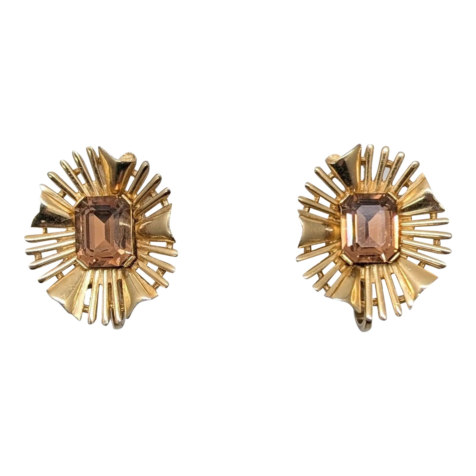 Vintage Signed Crown Trifari Goldtone Faux-Topaz "Ribbon" Clip Earrings- 2 Pieces: Goldtone emerald cut faux-topaz center with "burst" clip earrings. Marked crown "TRIFARI(C)." Measure: 1 inch long by 7/8 inches wide. Excellent condition. Circa 1966 based on similarly designed