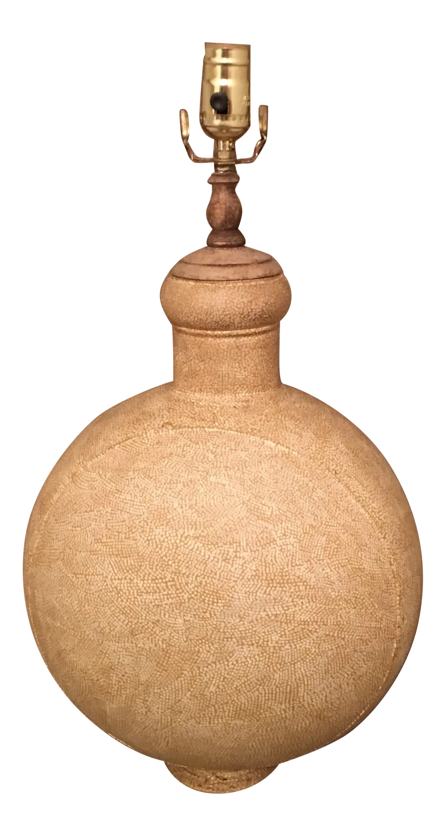 Beige Metal Oil Jar Table Lamp: This unique lamp is a reproduction of old oil jar lamps. Our skilled artisans have meticulously painted the shagreen (the dainty hand painted pattern.). The beige finish can go with varied furniture,
